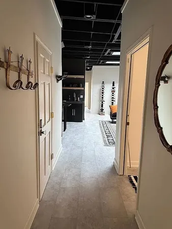 a living room with furniture and a rug