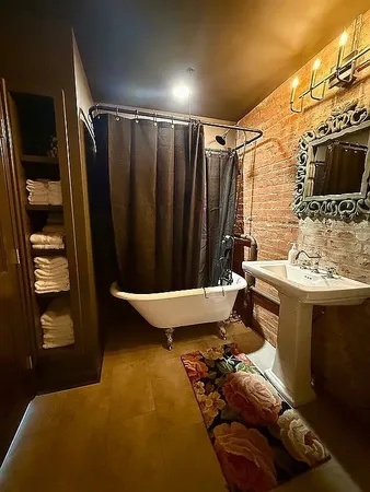 a bedroom with a bed and dresser