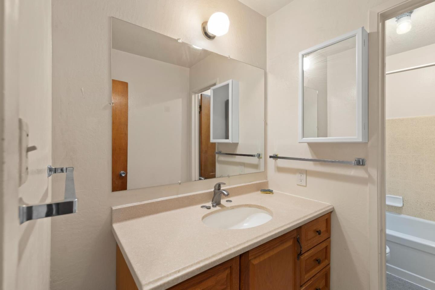 311 7th Street Davis, CA 95616 - Photo 12 of 18 a bathroom with a sink and a mirror