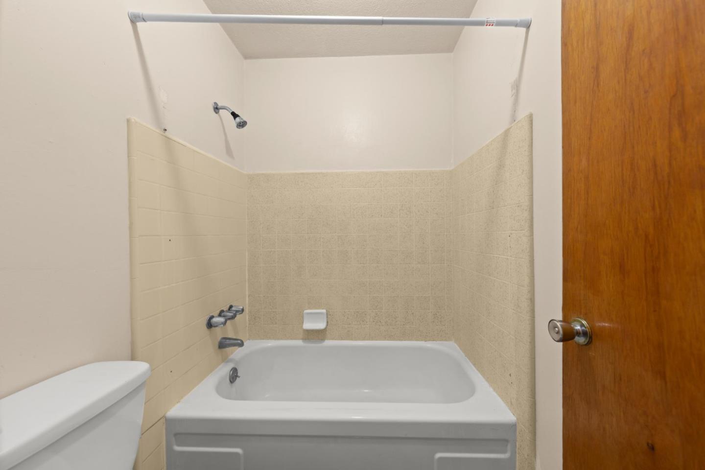 311 7th Street Davis, CA 95616 - Photo 13 of 18 a bathroom with a white bath tub