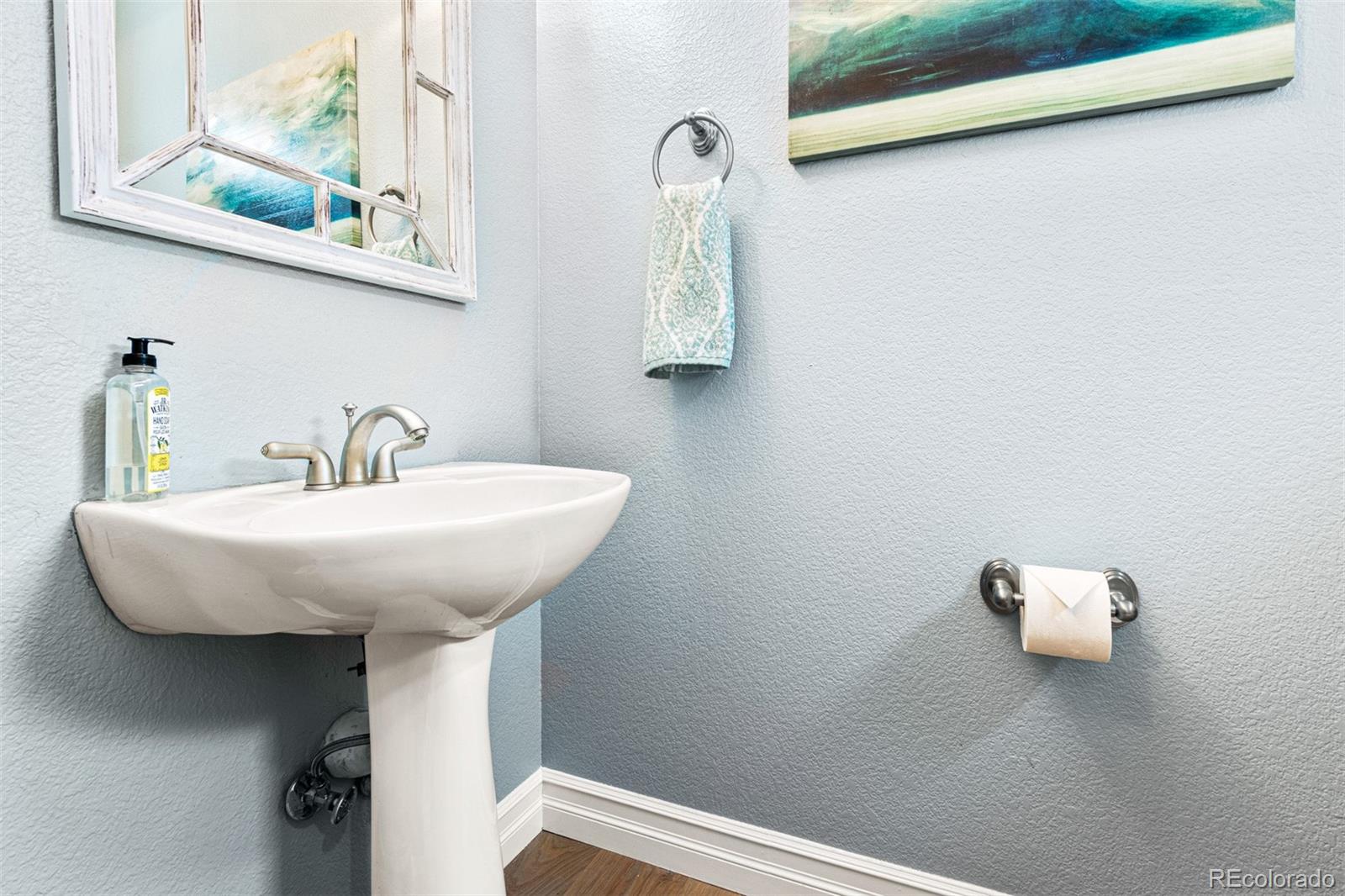 2323 Decatur Street Denver, CO 80211 - Photo 12 of 40 a bathroom with a sink and a mirror