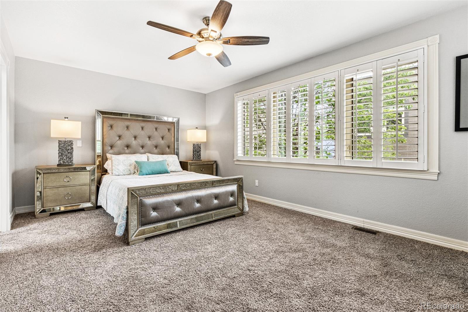 2323 Decatur Street Denver, CO 80211 - Photo 15 of 40 a bedroom with a bed next to a window