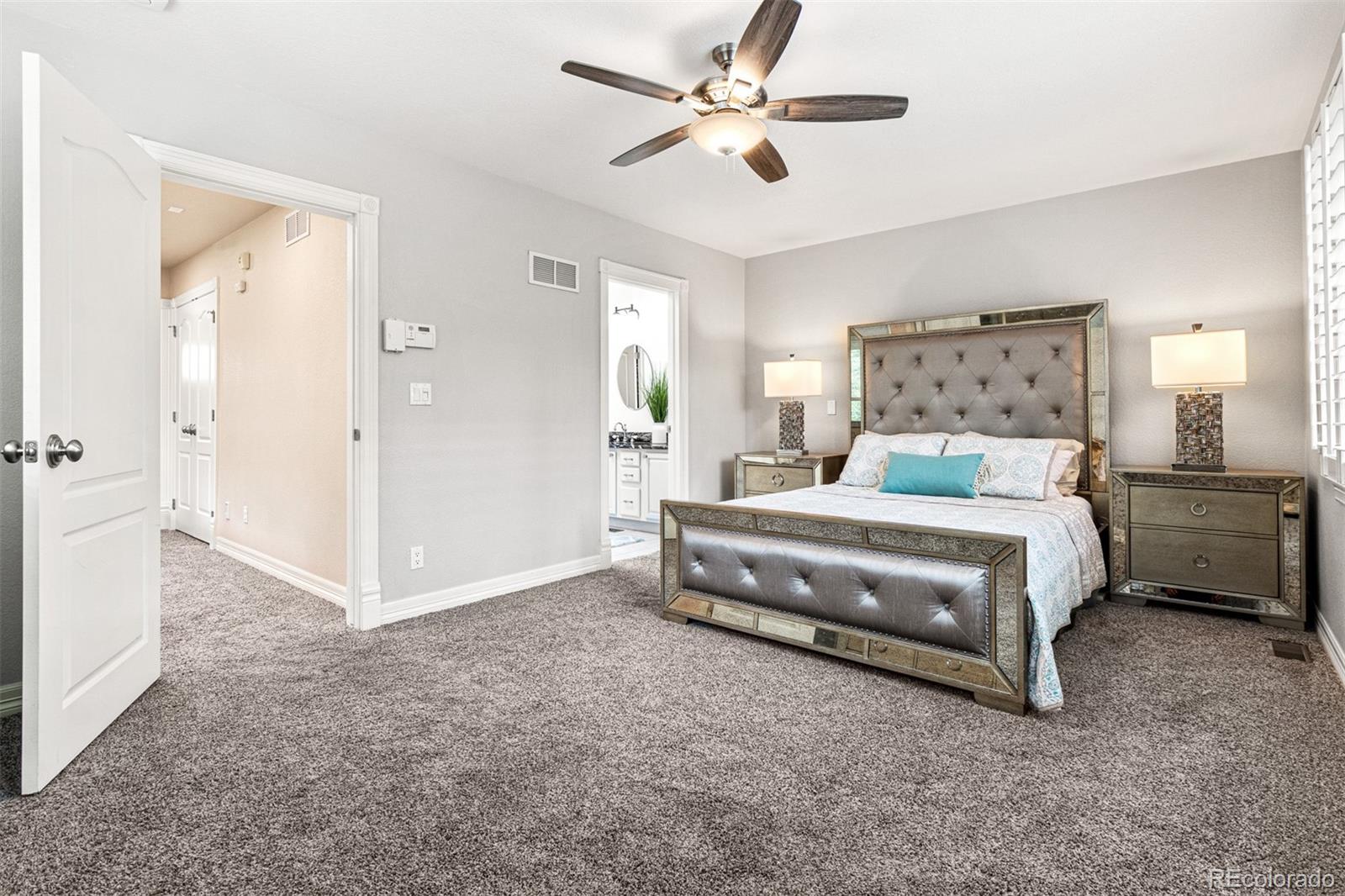 2323 Decatur Street Denver, CO 80211 - Photo 16 of 40 a bedroom with a bed and a chandelier