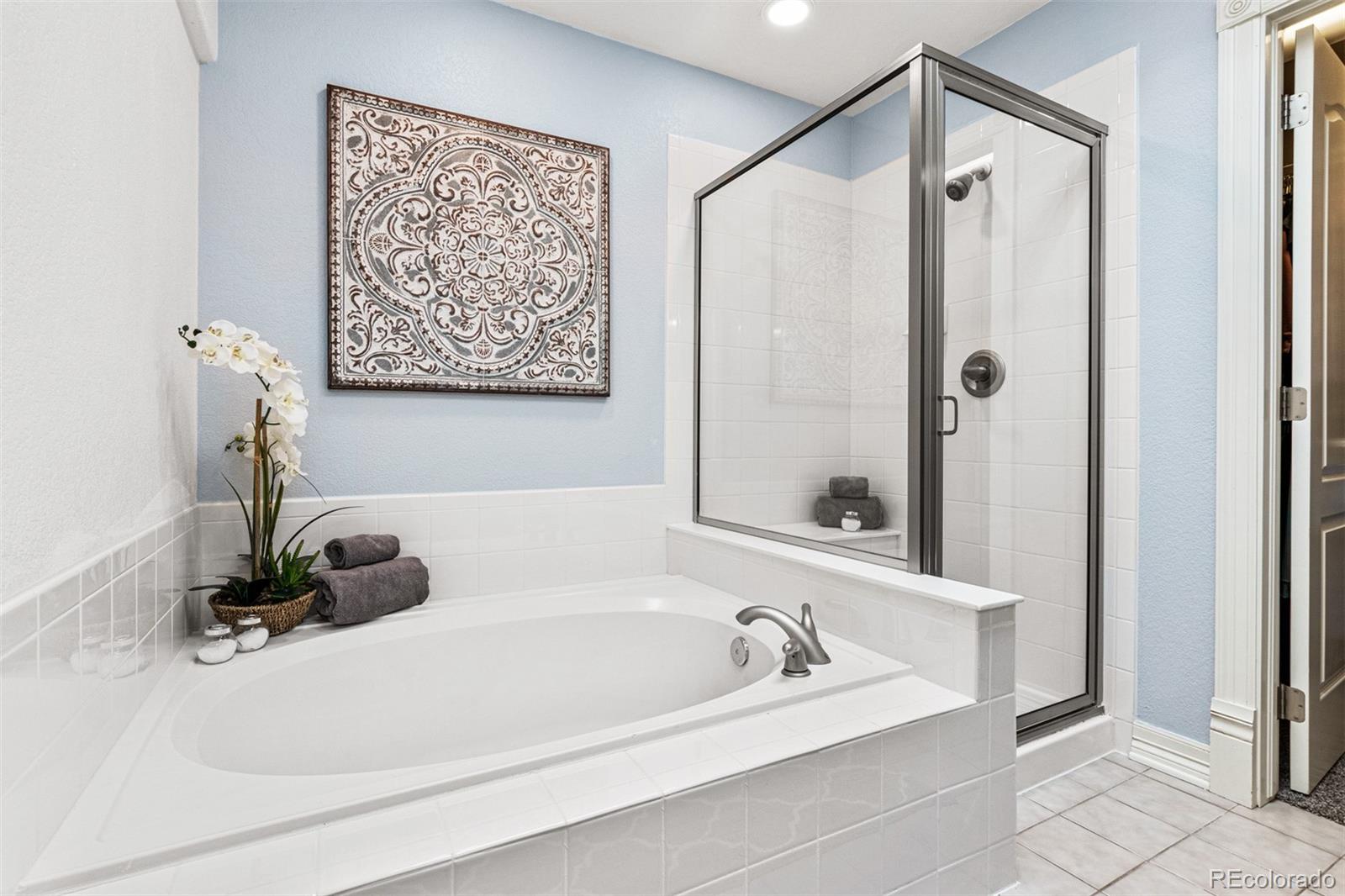 2323 Decatur Street Denver, CO 80211 - Photo 19 of 40 a bathroom with a bathtub and a shower
