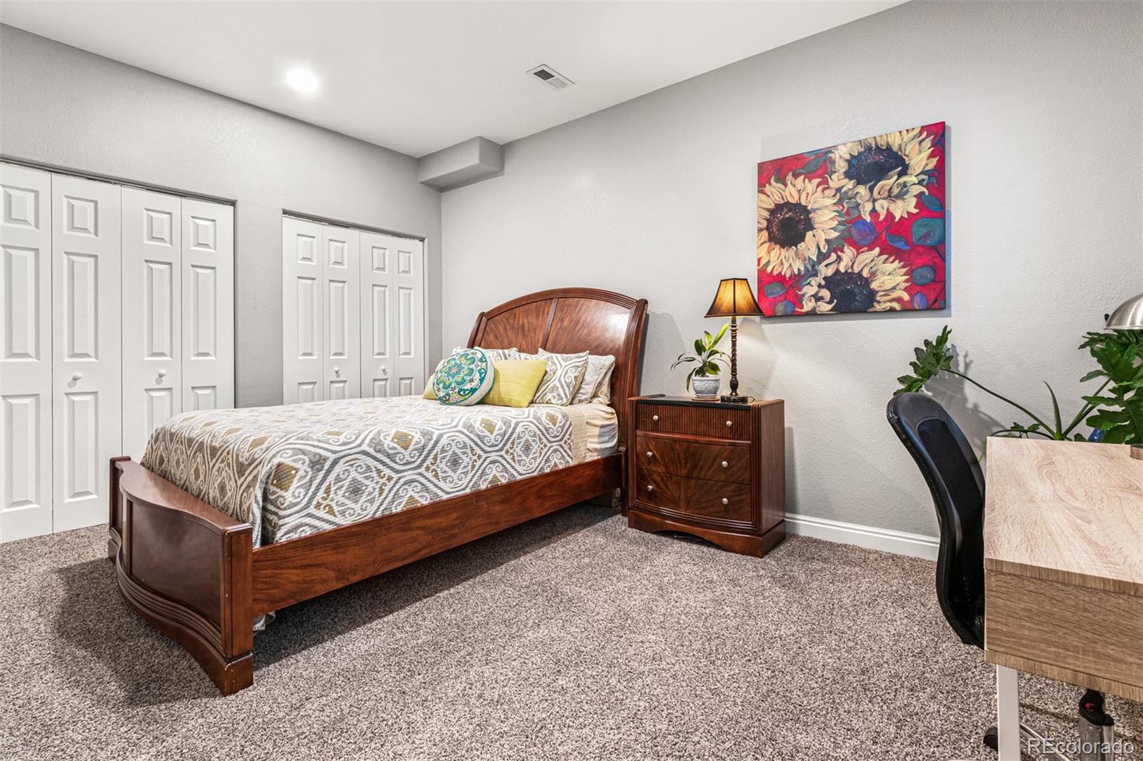 2323 Decatur Street Denver, CO 80211 - Photo 23 of 40 a bedroom with a bed and a painting on the wall