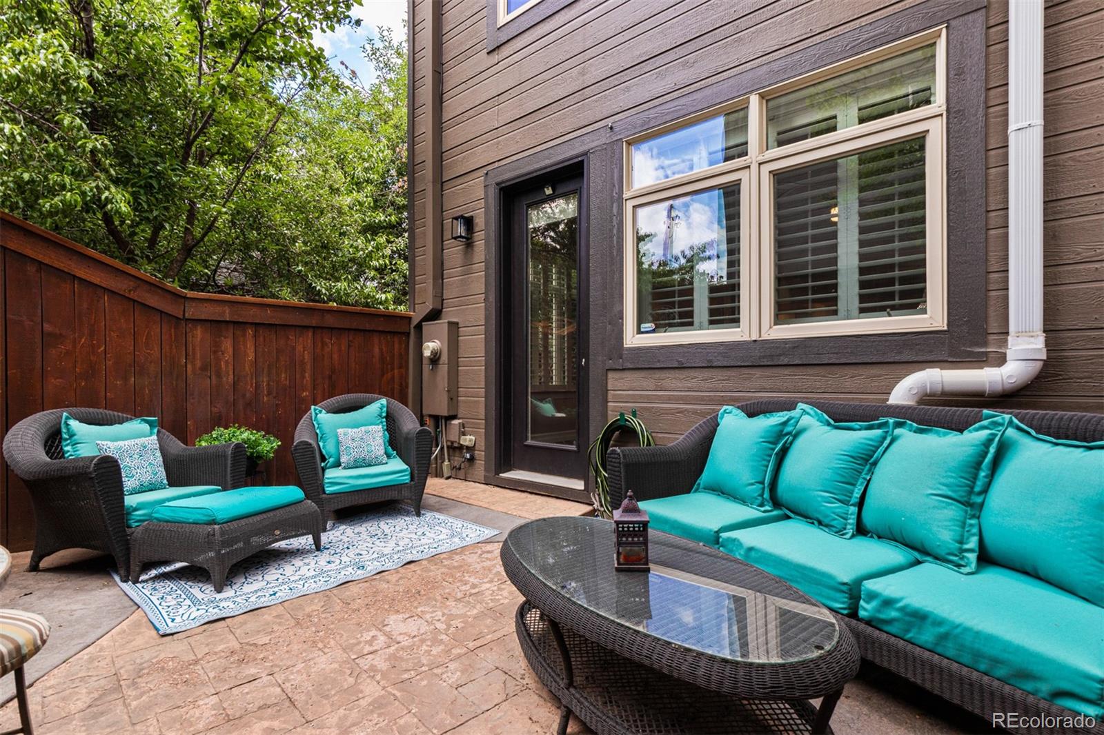 2323 Decatur Street Denver, CO 80211 - Photo 30 of 40 a view of a patio with couches chairs and a fire pit