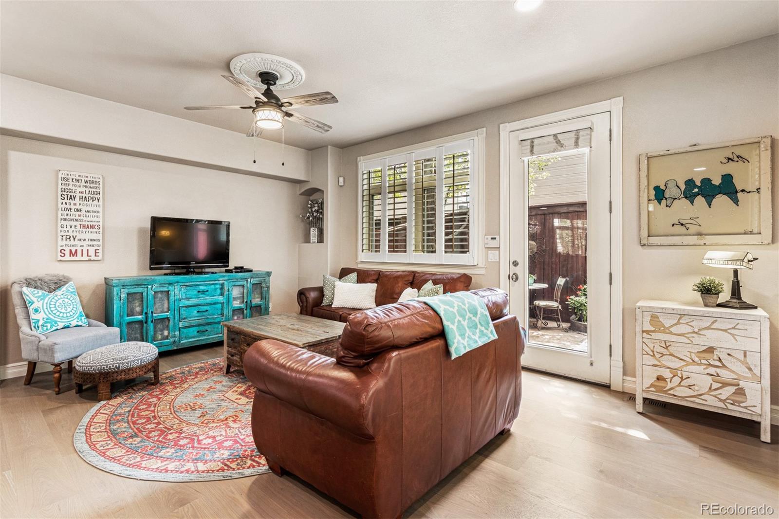 2323 Decatur Street Denver, CO 80211 - Photo 9 of 40 a living room with furniture and a flat screen tv