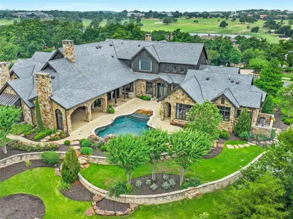 an aerial view of a house with a garden