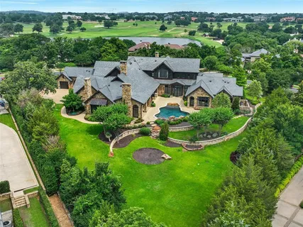 an aerial view of residential house with outdoor space and street view