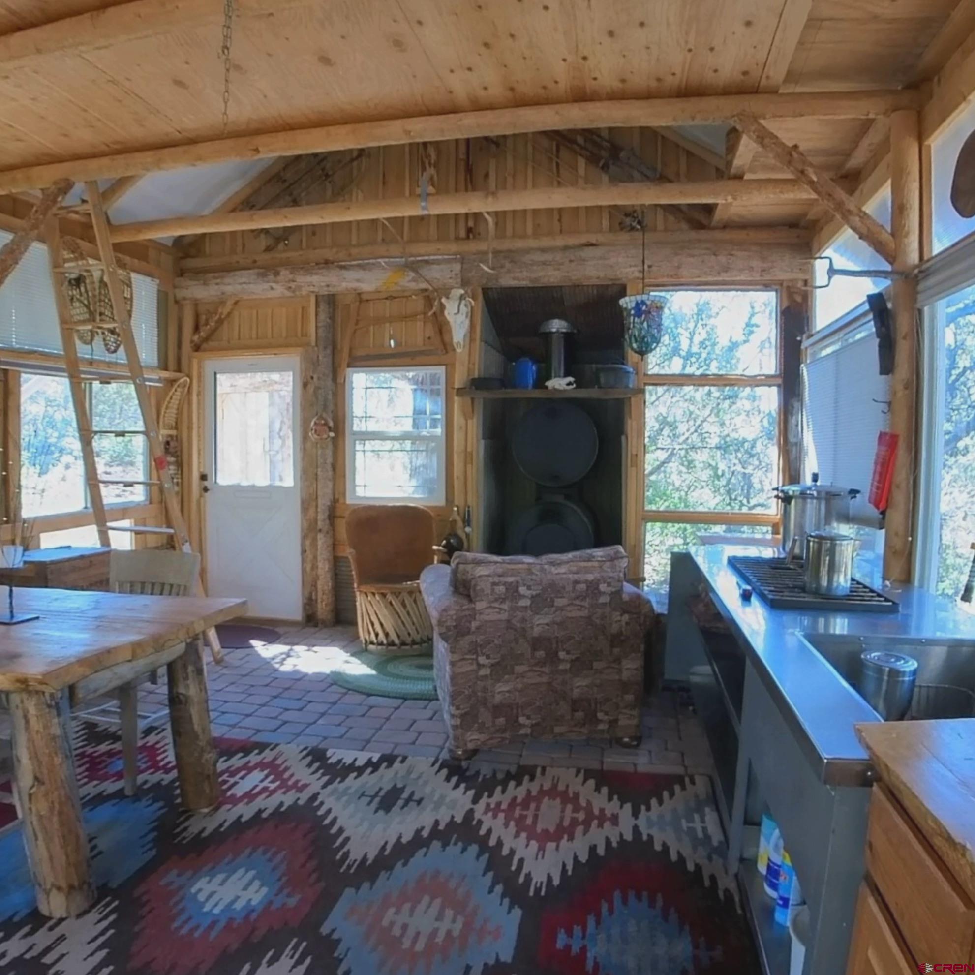 24279 Ute Trail Road Cedaredge, CO 81413 - Photo 5 of 15 a living room with furniture and a large window
