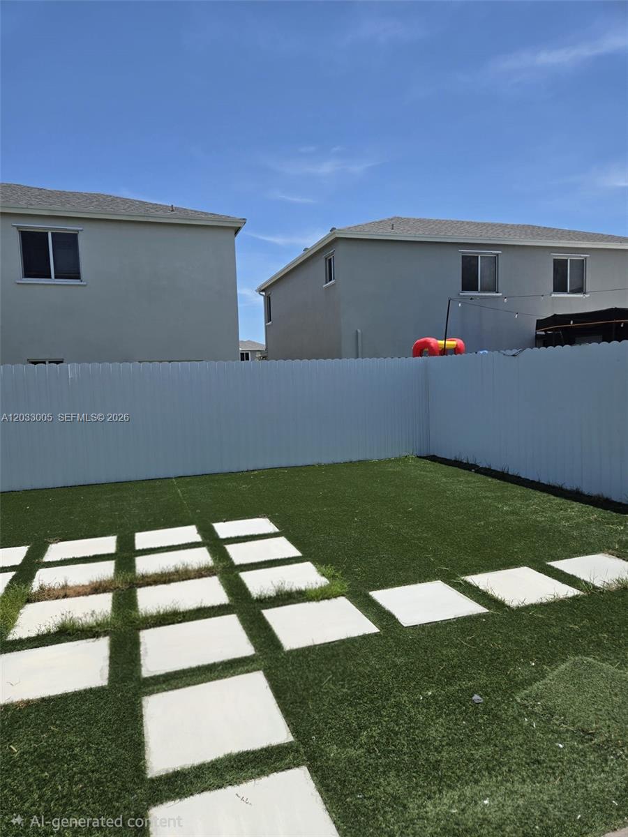 862 Southeast 17 Street, Unit 862 Homestead, FL 33034 - Photo 37 of 39 a front view of a house with a yard