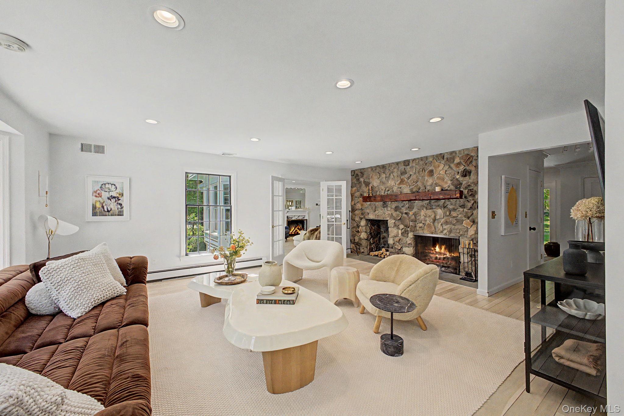 240 Eastwoods Road Pound Ridge, NY 10576 - Photo 19 of 46 a living room with fireplace furniture and a fireplace