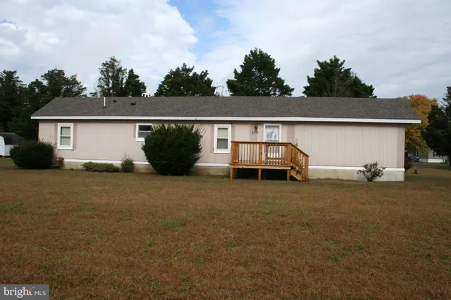 a view of a house with backyard space and garden