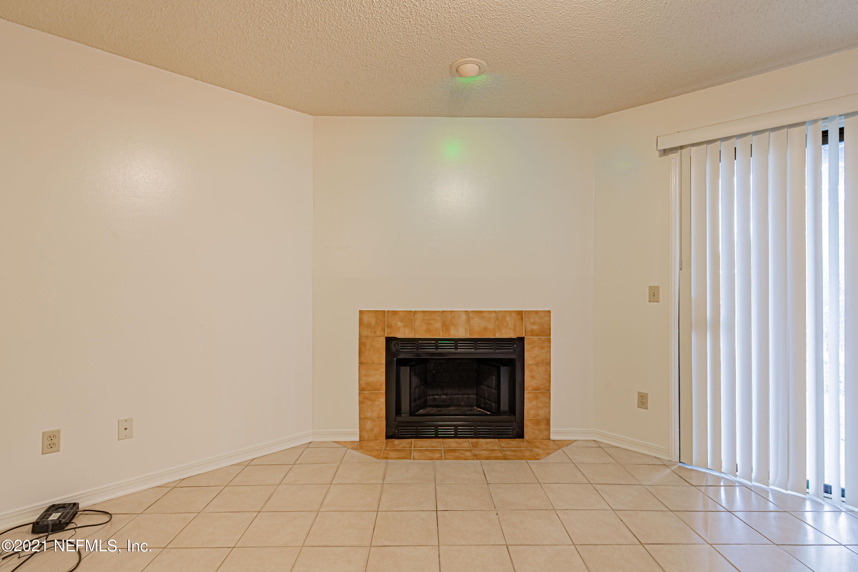 3517 Peeler Road, Unit 8 Jacksonville, FL 32277 - Photo 13 of 29 a room with a fireplace