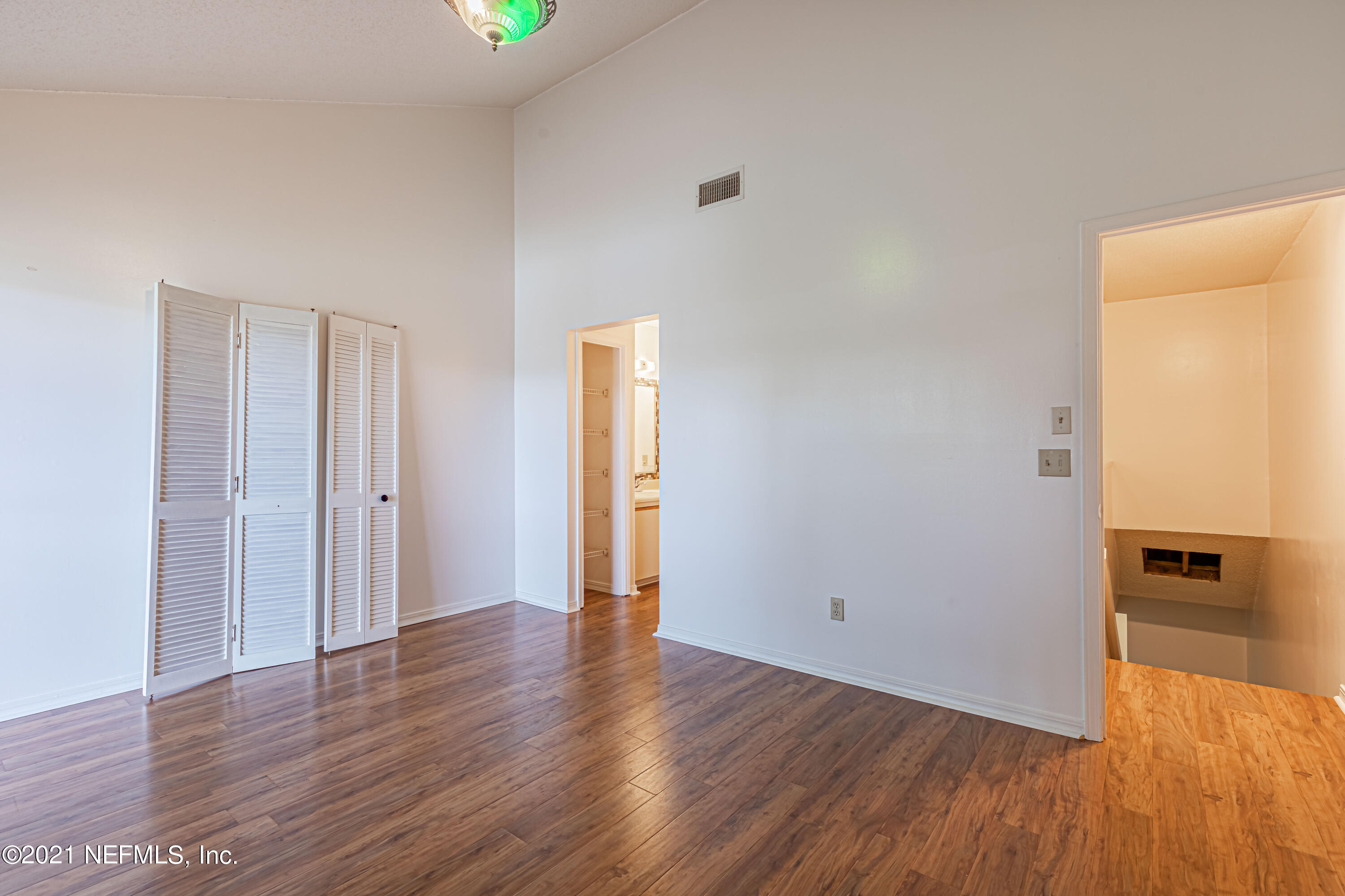 3517 Peeler Road, Unit 8 Jacksonville, FL 32277 - Photo 15 of 29 a view of a hallway with wooden floor