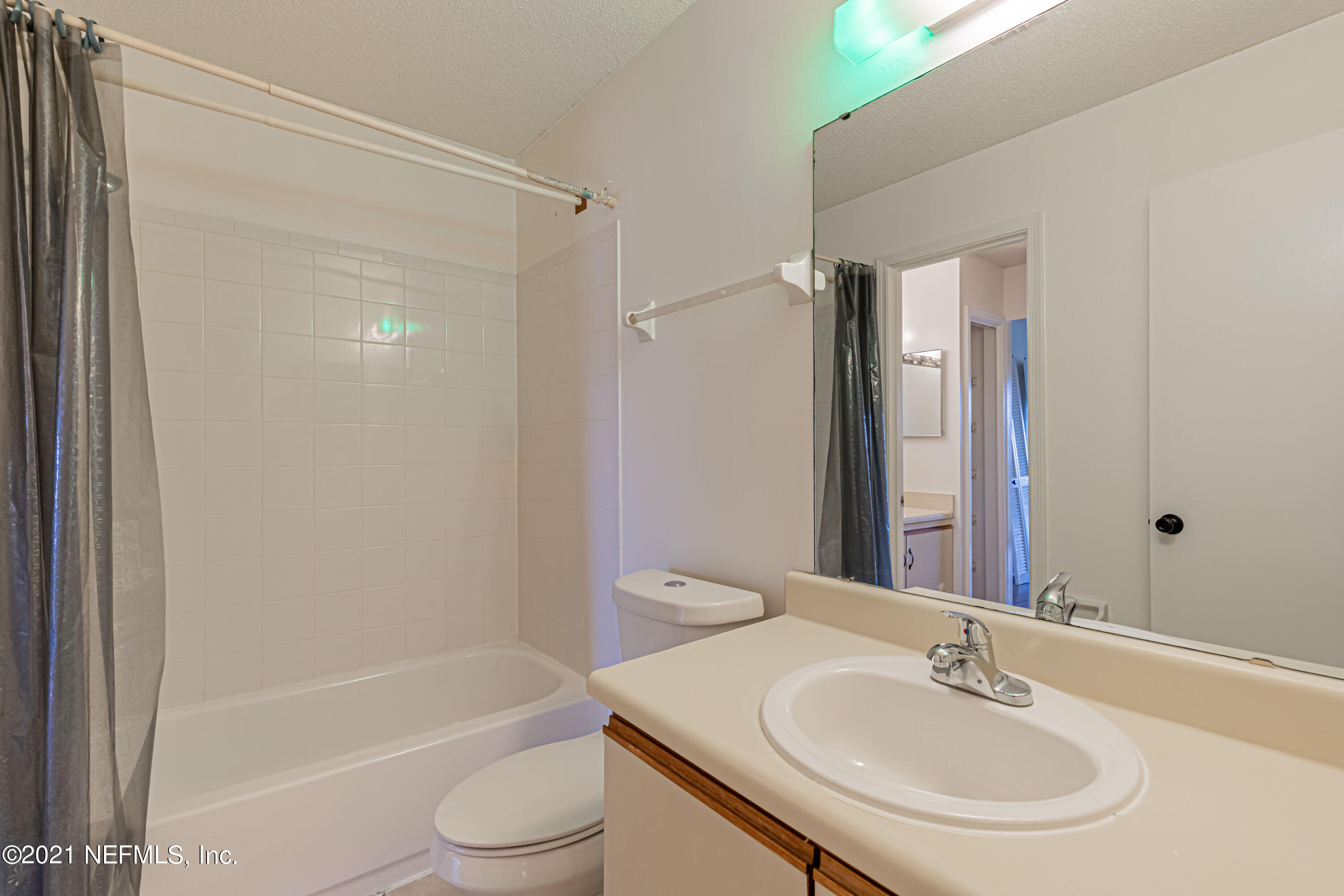 3517 Peeler Road, Unit 8 Jacksonville, FL 32277 - Photo 19 of 29 a bathroom with a sink toilet and shower