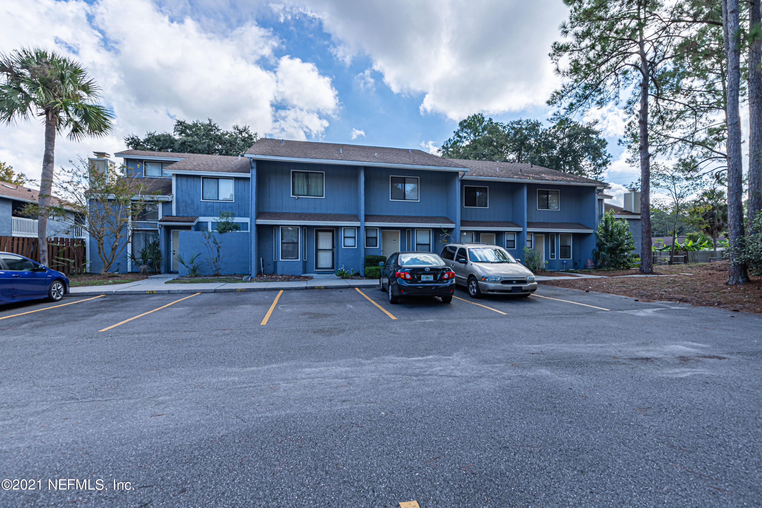 3517 Peeler Road, Unit 8 Jacksonville, FL 32277 - Photo 2 of 29 a house view with a car parked in front of it