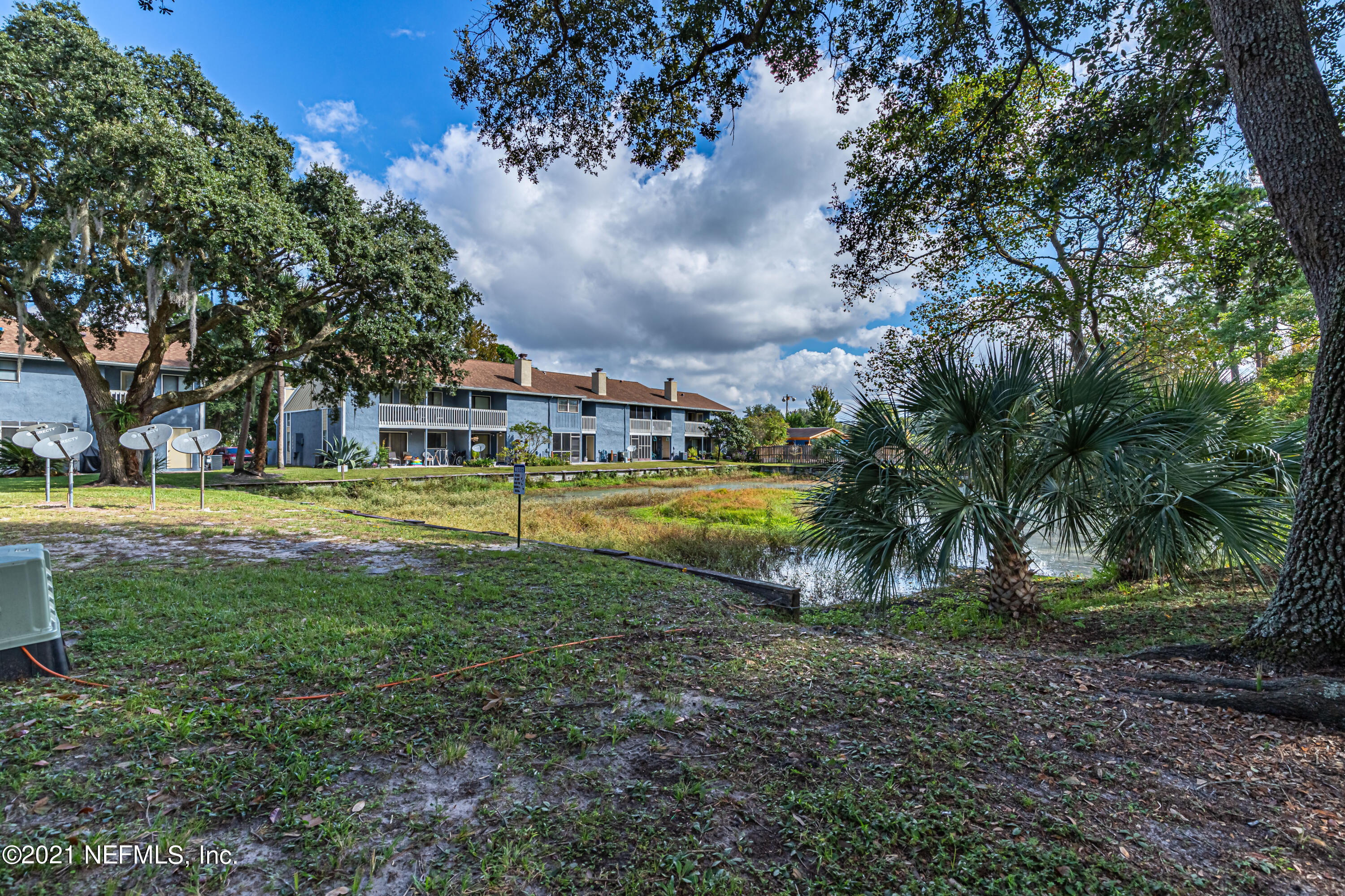 3517 Peeler Road, Unit 8 Jacksonville, FL 32277 - Photo 25 of 29 a view of swimming pool with tree s