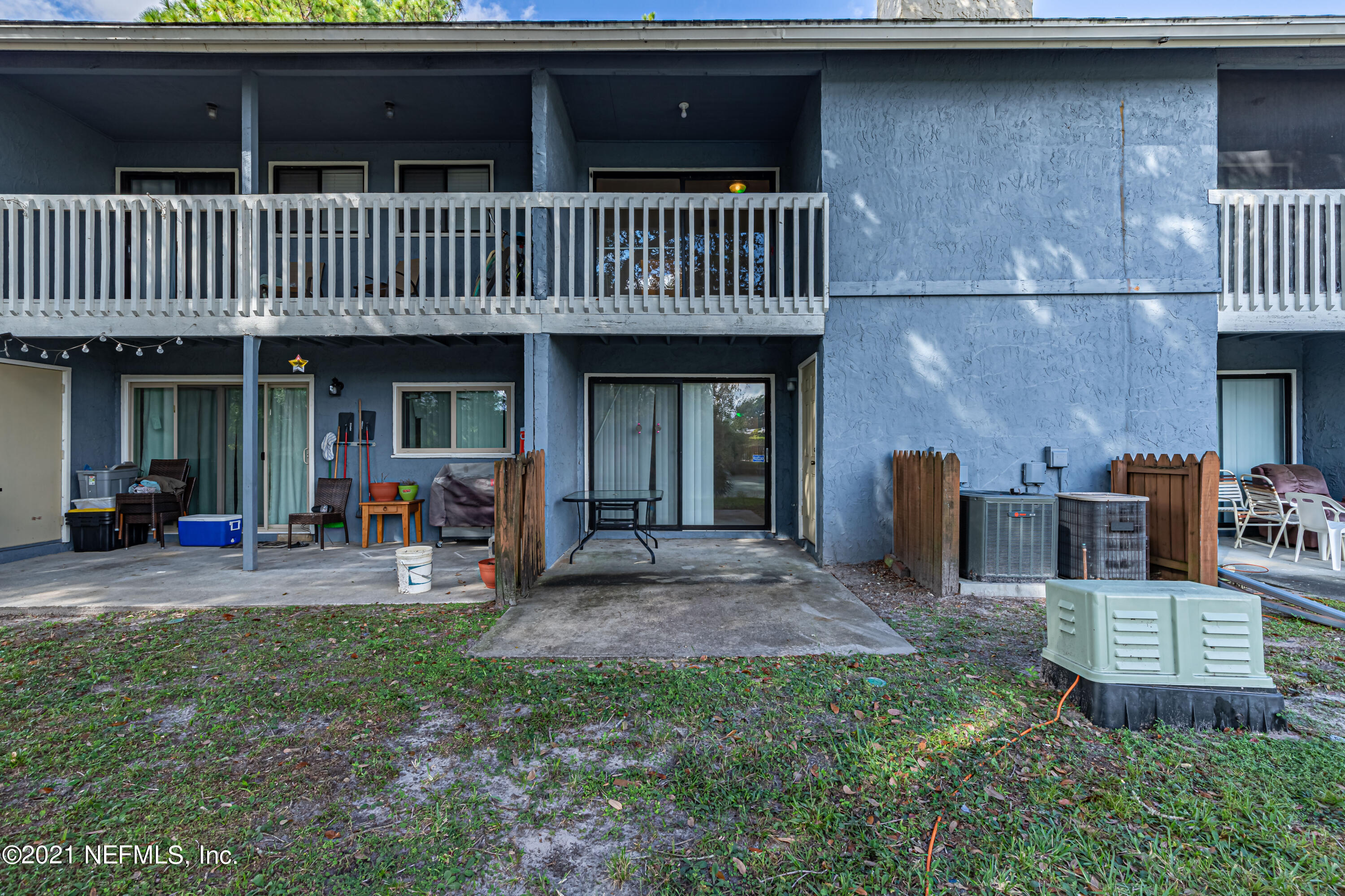 3517 Peeler Road, Unit 8 Jacksonville, FL 32277 - Photo 27 of 29 a view of a chair and table in backyard of the house