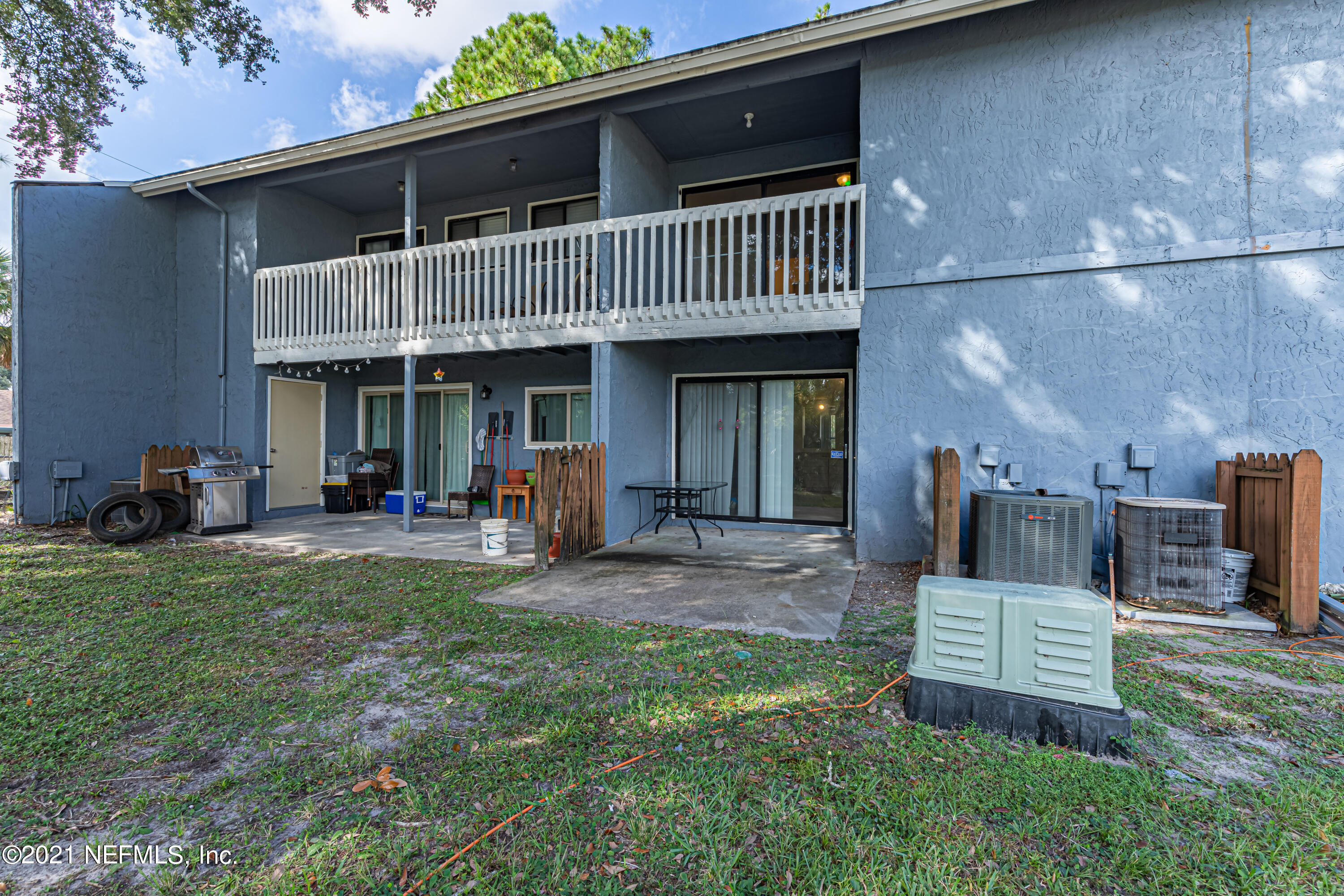 3517 Peeler Road, Unit 8 Jacksonville, FL 32277 - Photo 28 of 29 a view of a chair and table in backyard of the house