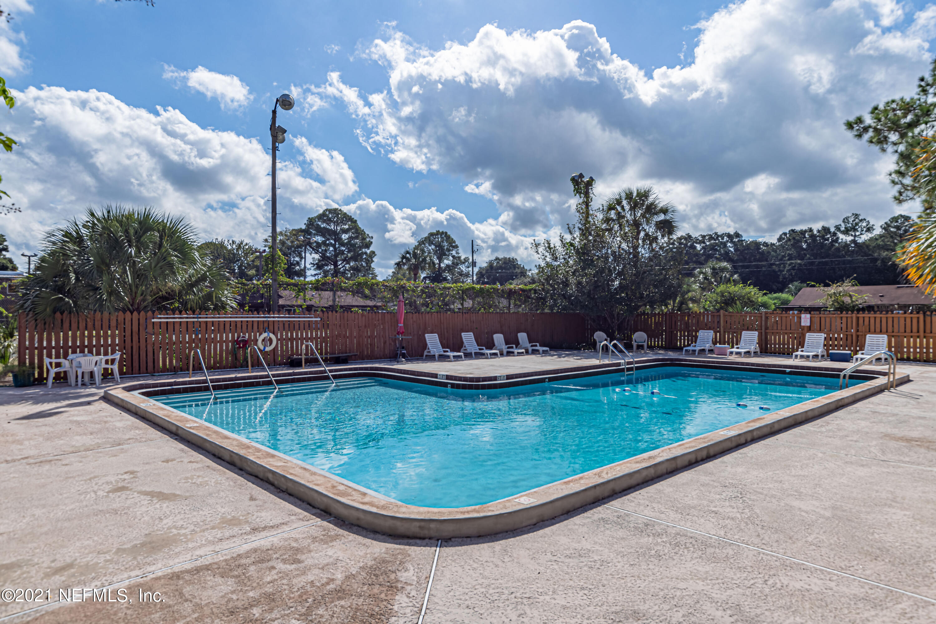 3517 Peeler Road, Unit 8 Jacksonville, FL 32277 - Photo 29 of 29 a view of a swimming pool with a terrace