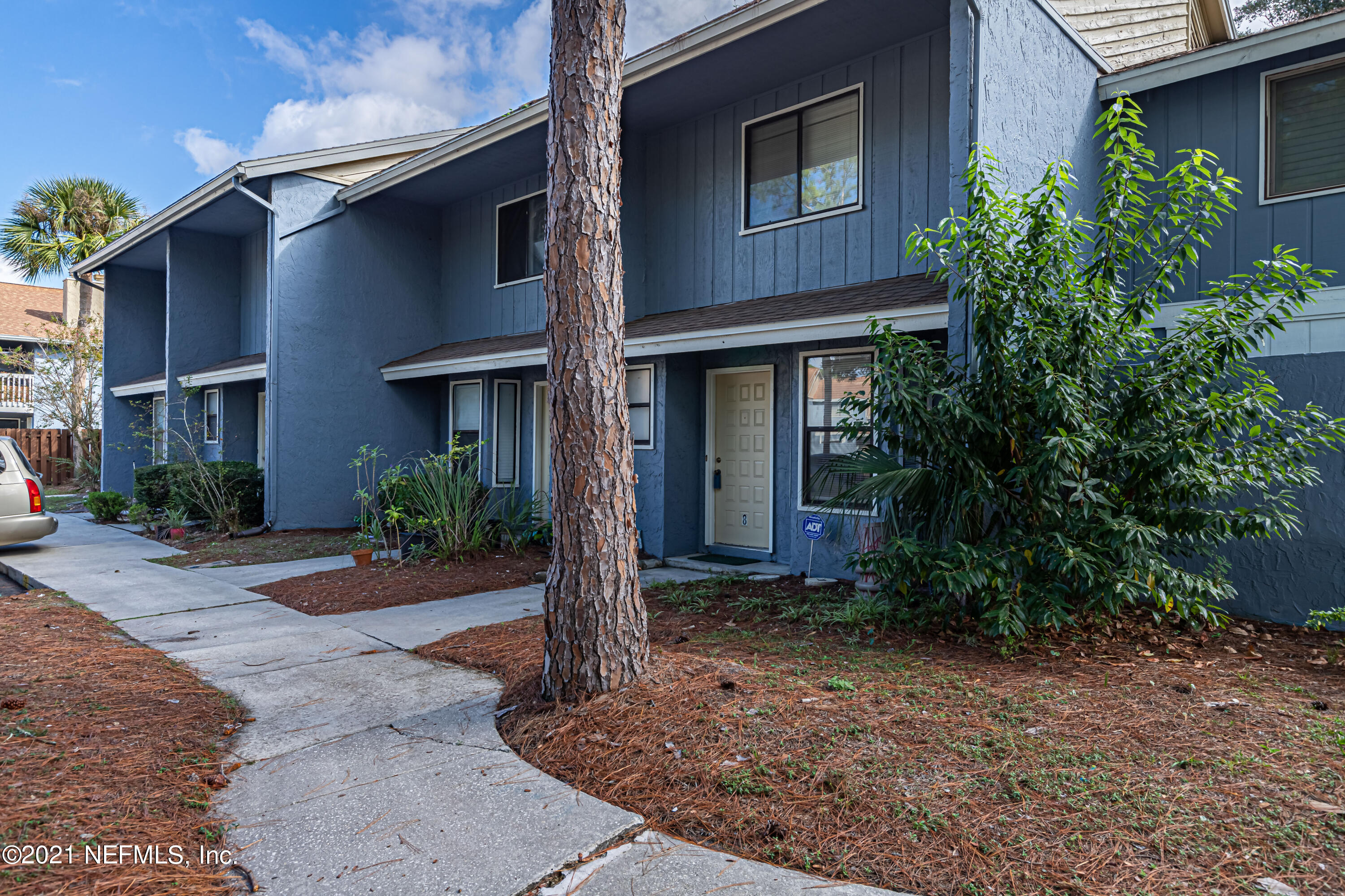 3517 Peeler Road, Unit 8 Jacksonville, FL 32277 - Photo 3 of 29 a house view with a garden space