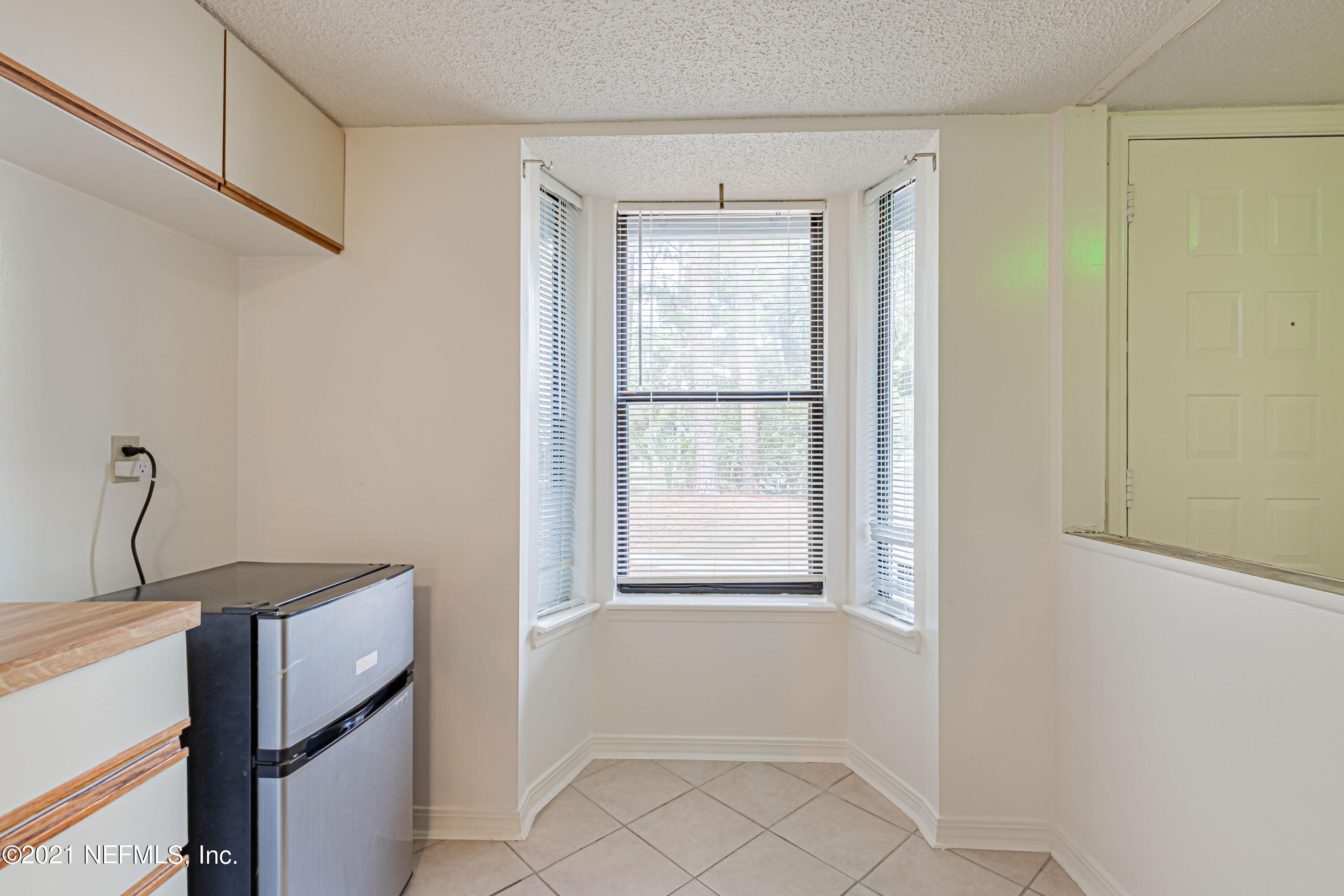3517 Peeler Road, Unit 8 Jacksonville, FL 32277 - Photo 7 of 29 a view of an empty room with a window