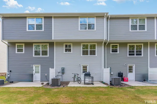a view of a patio with table and chairs