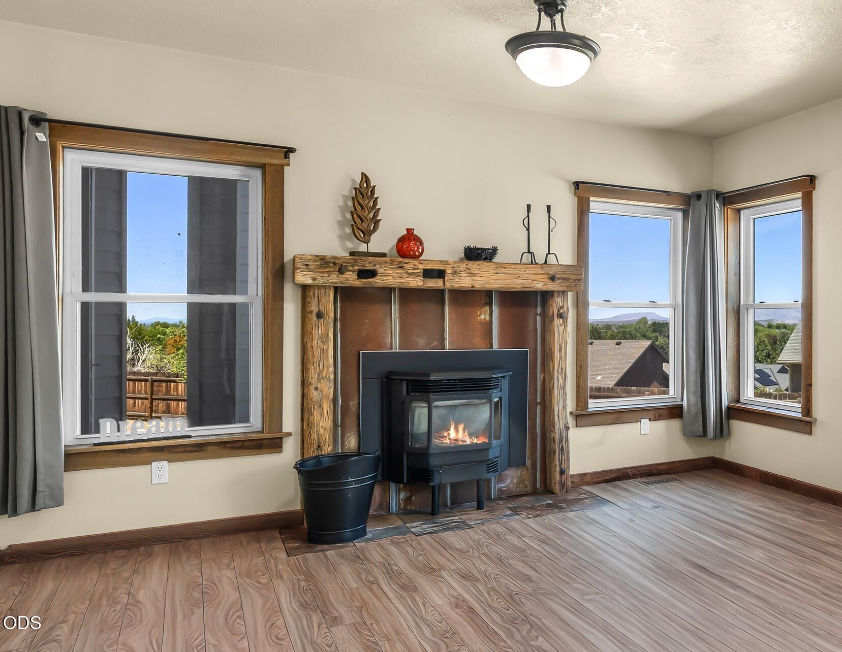 2486 Southwest Valleyview Drive Redmond, OR 97756 - Photo 13 of 55 a living room with furniture and a fireplace
