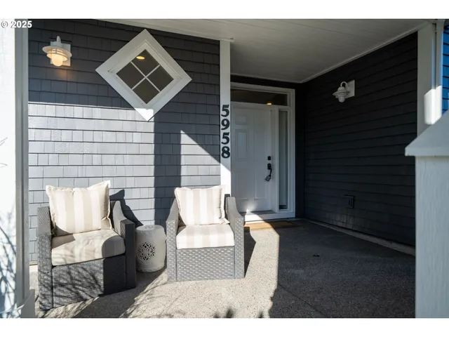a view of living room with furniture and wooden floor
