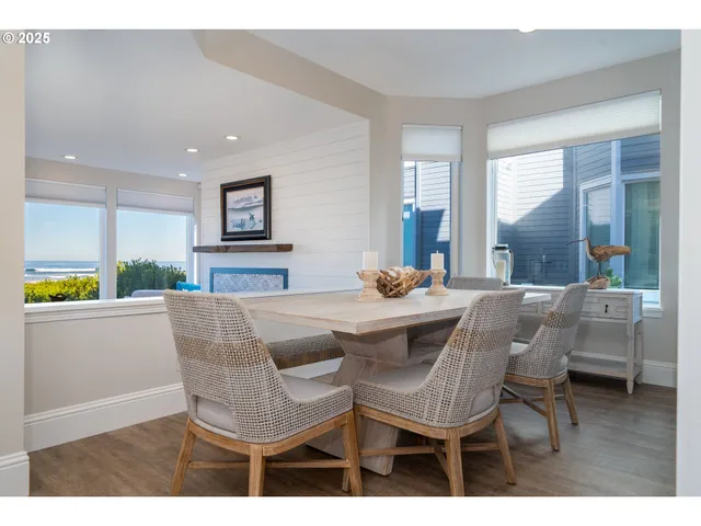 a kitchen with granite countertop white cabinets and a stove