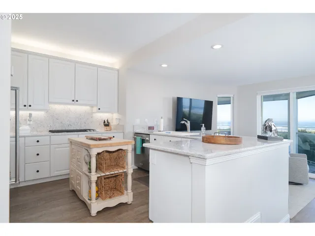 a bathroom with a granite countertop sink and a large mirror