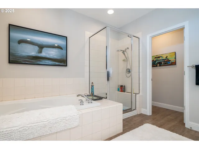 a bathroom with a sink shower and a mirror