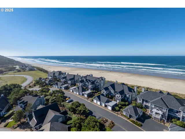 a view of a large building next to a yard