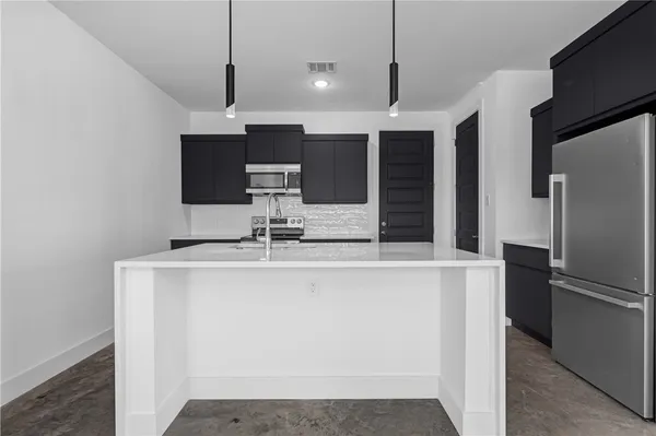 a view of a kitchen with a sink
