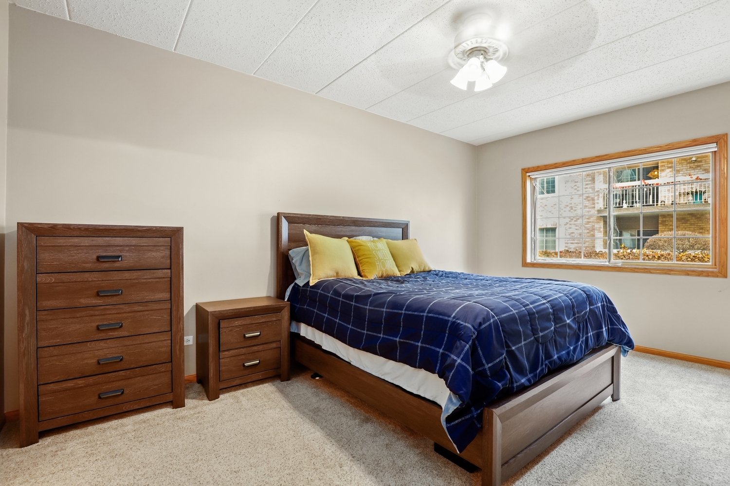 7825 Bristol Park Drive, Unit 1C Tinley Park, IL 60477 - Photo 12 of 22 a spacious bedroom with a bed and a window