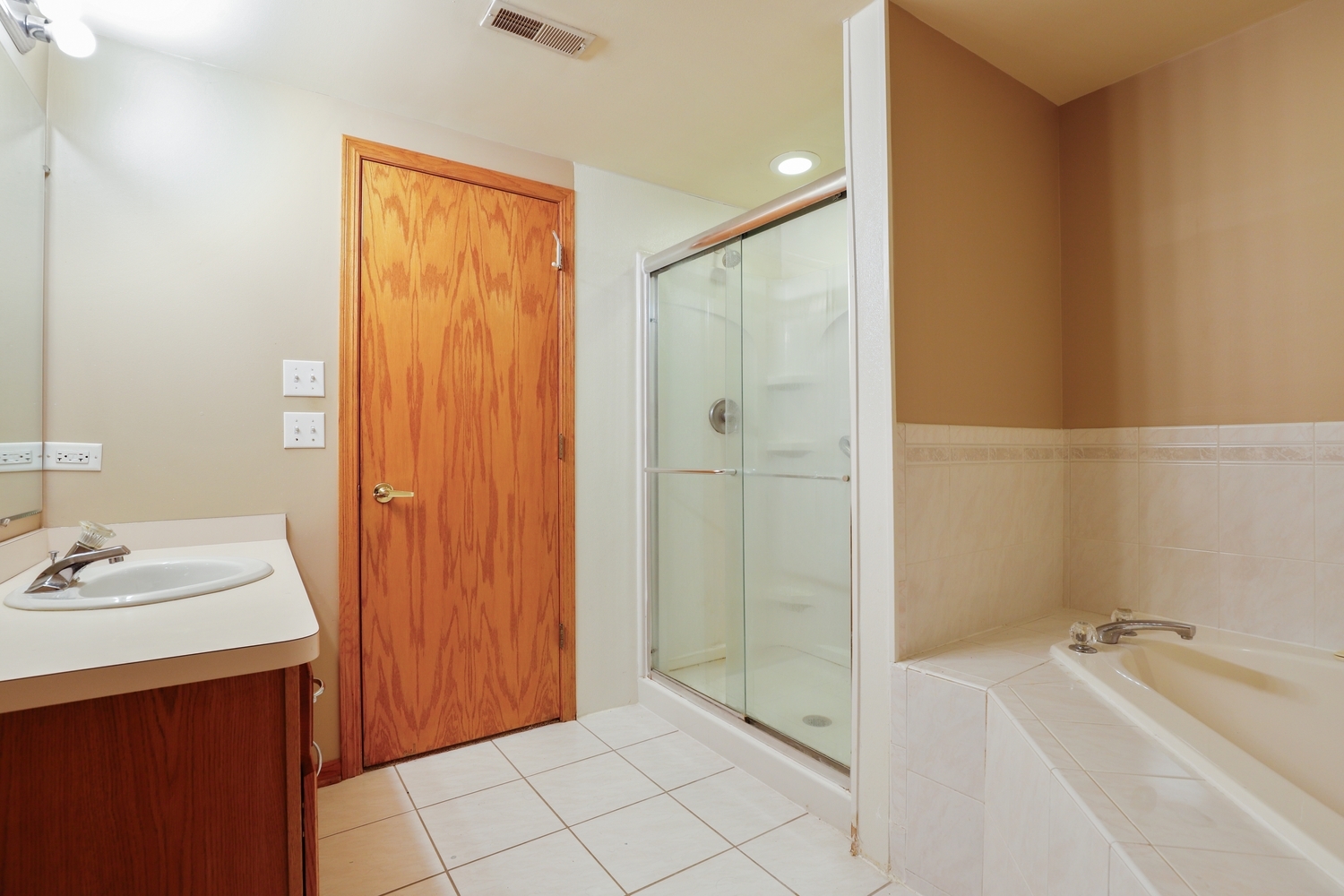 7825 Bristol Park Drive, Unit 1C Tinley Park, IL 60477 - Photo 14 of 22 a bathroom with a tub sink and shower