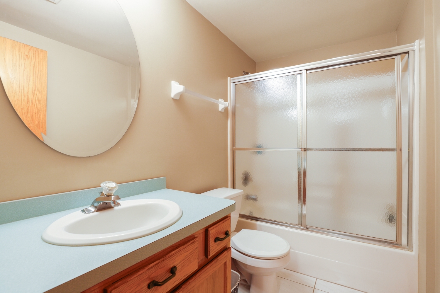 7825 Bristol Park Drive, Unit 1C Tinley Park, IL 60477 - Photo 16 of 22 a bathroom with a sink toilet and a mirror
