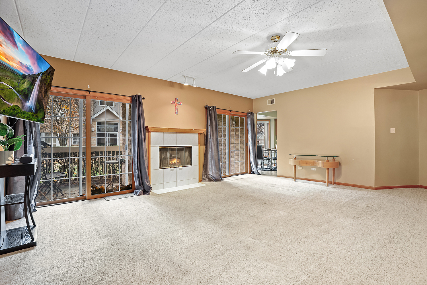 7825 Bristol Park Drive, Unit 1C Tinley Park, IL 60477 - Photo 4 of 22 a view of an empty room with window and fireplace