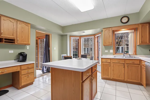 a kitchen that has a sink and a stove in it