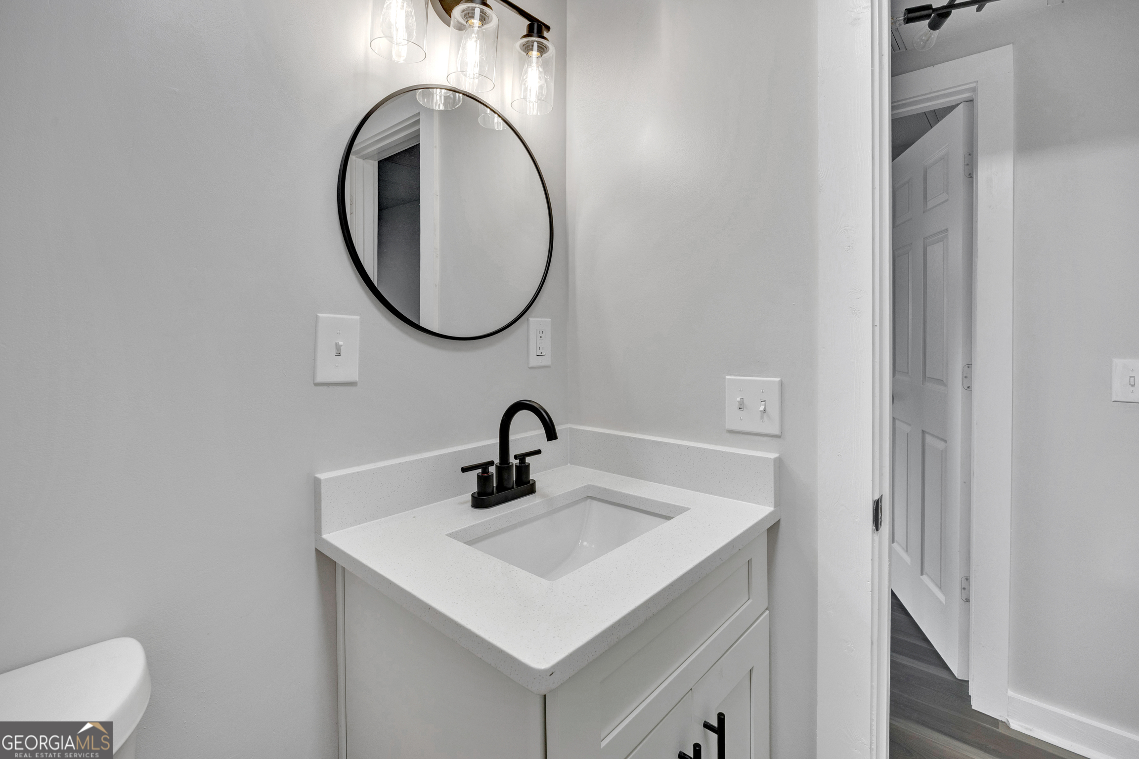 455 Cindy Street Jackson, GA 30233 - Photo 18 of 25 a bathroom with a sink and a mirror
