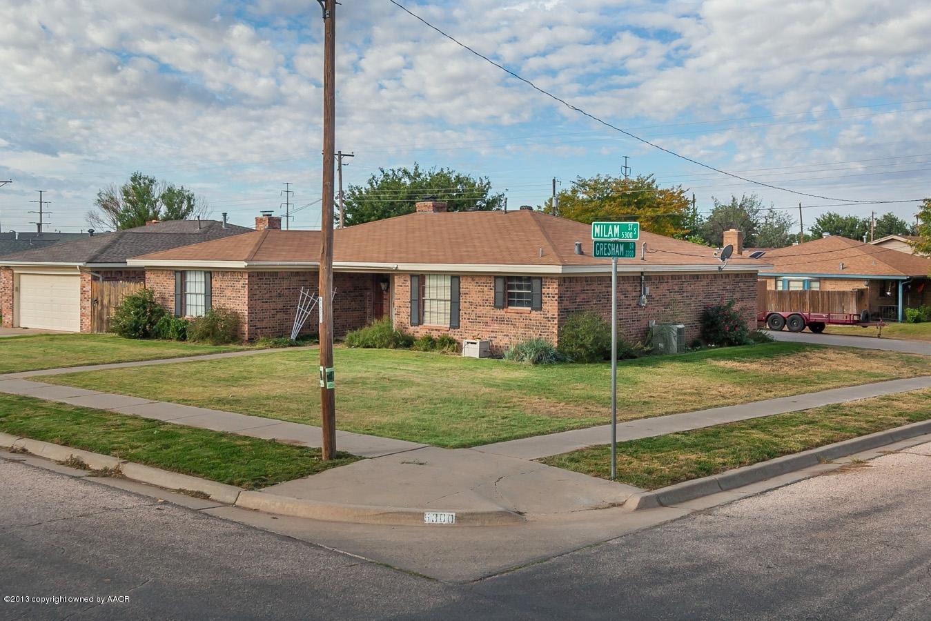 5300 South Milam Street Amarillo, TX 79110 - Photo 5 of 21 a front view of a house with a yard