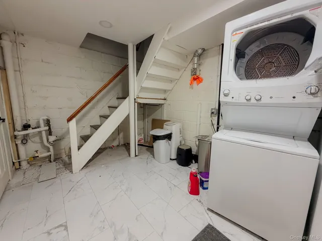 a utility room with dryer and washer