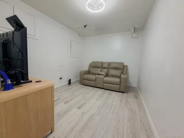 a room with furniture and a flat screen tv