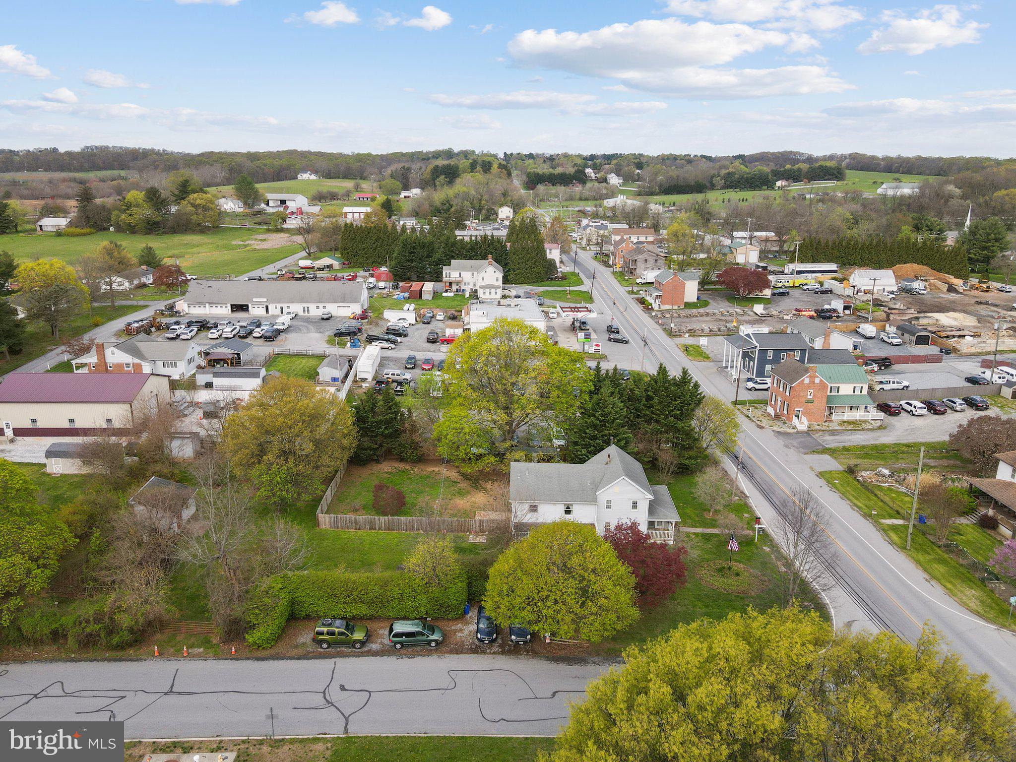 15921 Frederick Road Woodbine, MD 21797 - Photo 37 of 41 Charming townscape with lush greenery.