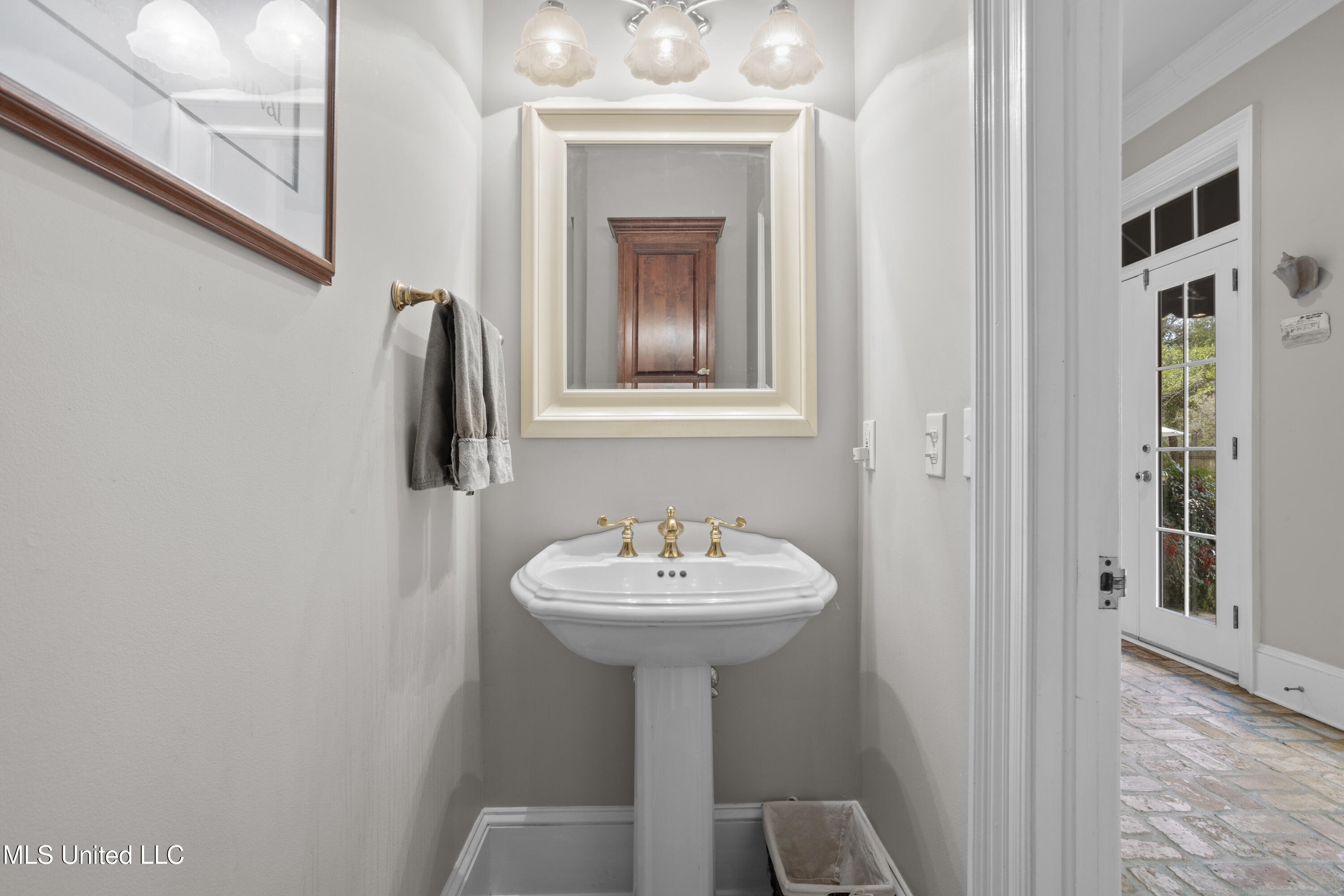 1315 East 2nd Street Pass Christian, MS 39571 - Photo 36 of 84 Half bath near game room