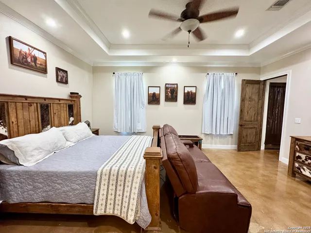 a bed room with a bed and a couch