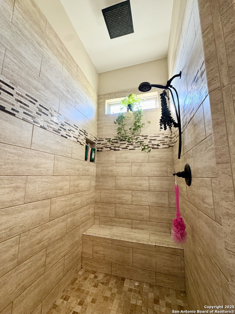 16489 Farm To Market Road 472 Devine, TX 78016 - Photo 14 of 31 a bathroom with a shower