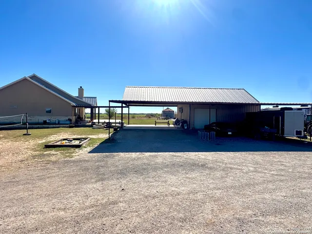 a view of swimming pool with lawn chairs