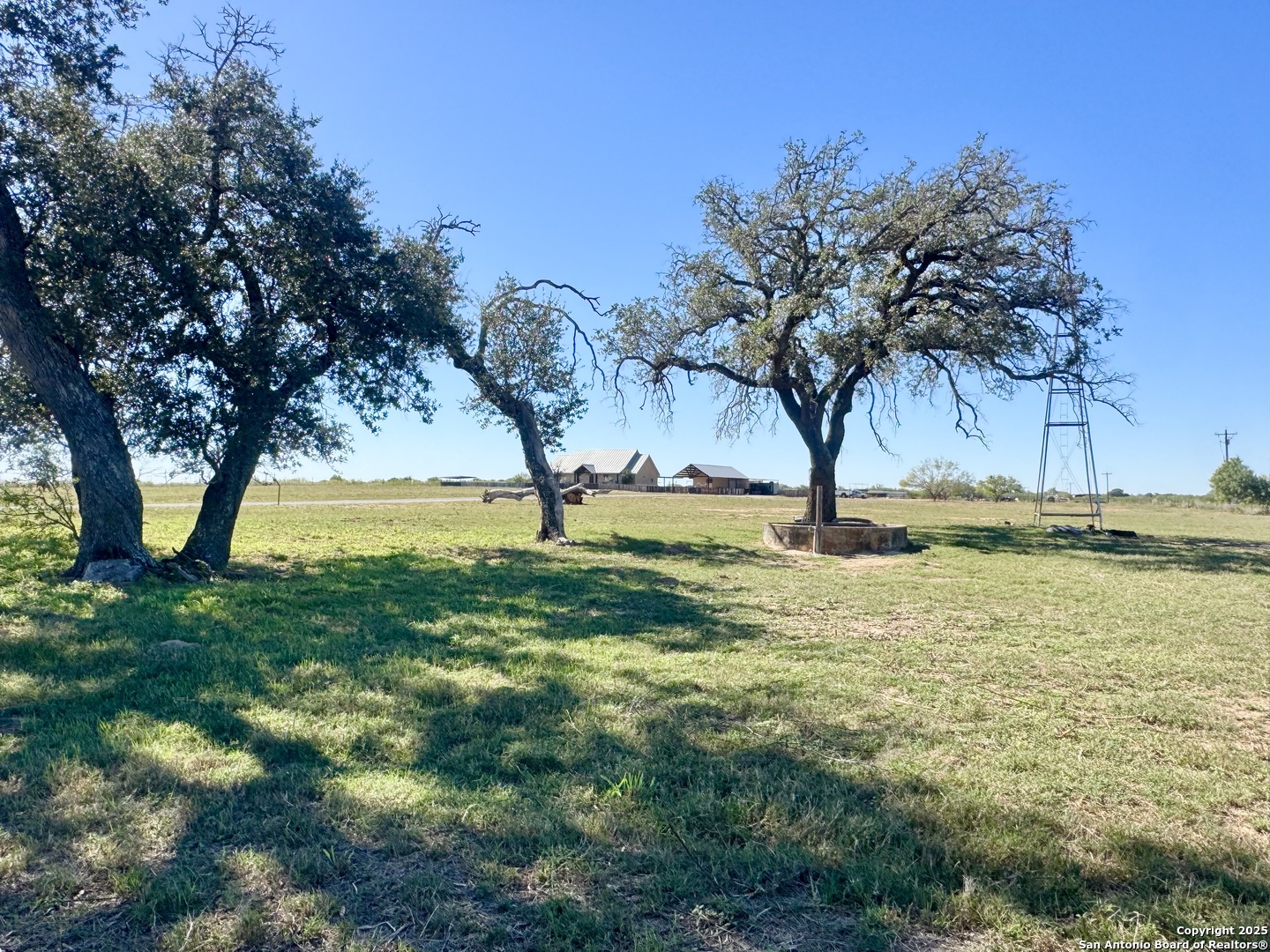 16489 Farm To Market Road 472 Devine, TX 78016 - Photo 25 of 31 a view of swimming pool with a yard